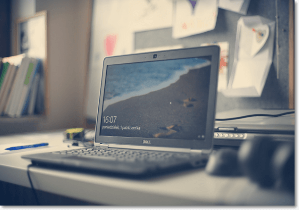 a dell laptop sitting on a desk